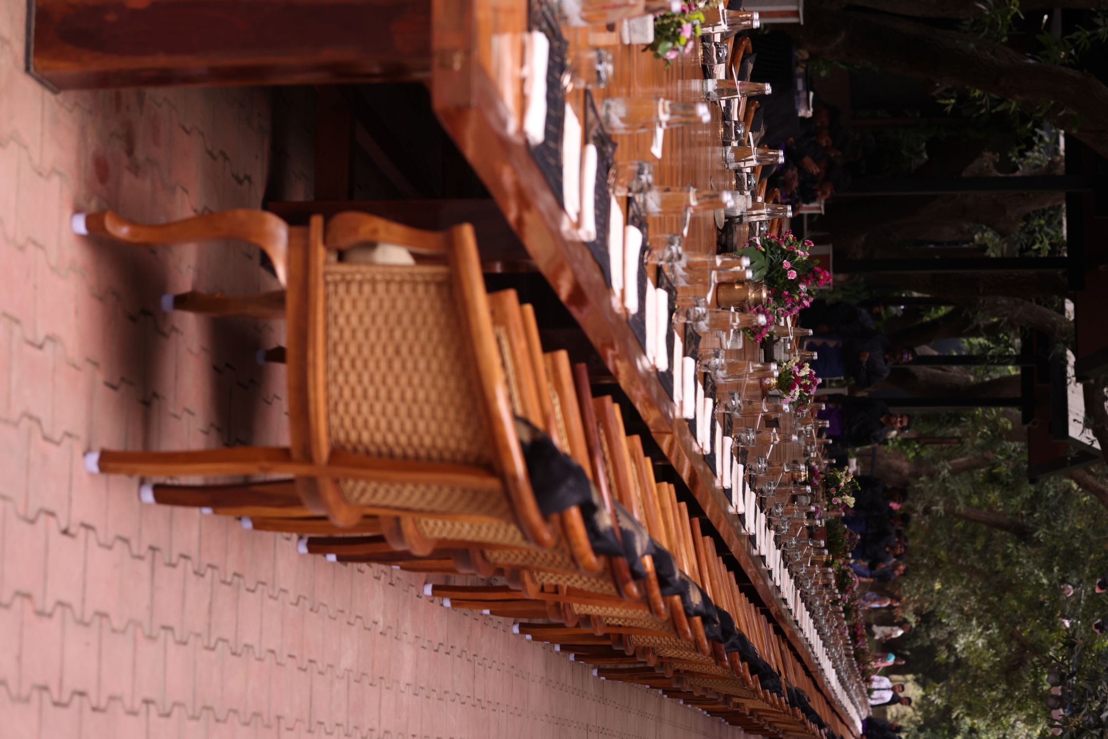 Place settings and floral centerpieces along Hanu's Table